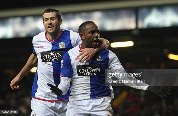 Benni McCarthy of Blackburn Rovers celebrates scoring his team's third goal with team mate Brett Emerton during the Carling Cup Quarter Final match...