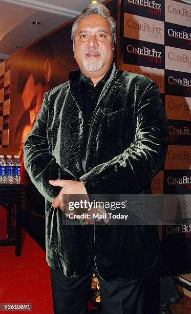 Industrialist Vijay Mallya with director Karan Johar during the launch of Cine Blitz magazine's new book 'Love and Longing in Hindi Cinema', in...