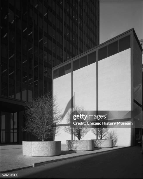 View of Dirksen Federal Building of the Chicago Federal Center showing the mirrored wall of low-rise structure, Chicago, IL, ca.1960s. Designed by...