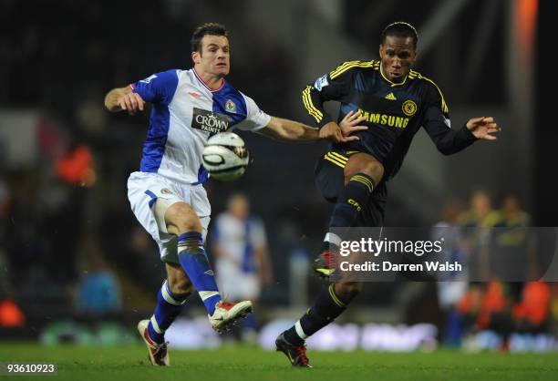 Ryan Nelsen of Blackburn Rovers tangles with Didier Drogba of Chelsea during the Carling Cup Quarter Final match between Blackburn Rovers and Chelsea...