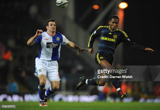 Ryan Nelsen of Blackburn Rovers tangles with Didier Drogba of Chelsea during the Carling Cup Quarter Final match between Blackburn Rovers and Chelsea...