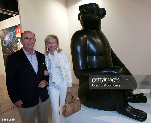 Billionaire investor Wilbur L. Ross, left, and wife Hilary Geary Ross stand near the sculpture "Singe Avise " by Francois Xavier Lalanne, which they...