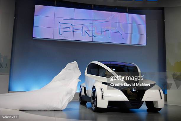 The veil is pulled from the new three-seat Honda P-NUT with a clear roof as it is debuted during press preview days of the 2009 LA Auto Show at the...