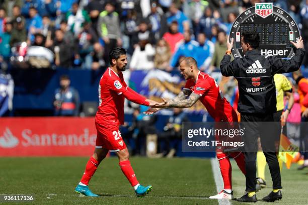 Nolito of Sevilla and Sandro Ramirez of Sevilla slap hands during the La Liga match between Leganes and Sevilla at Estadio Municipal de Butarque on...