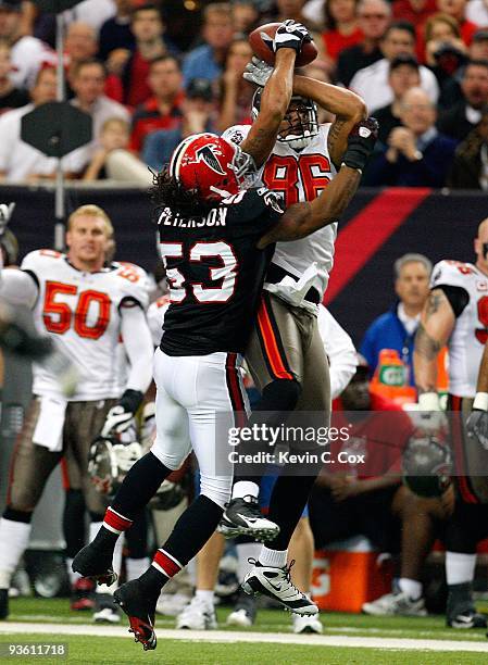 Jerramy Stevens of the Tampa Bay Buccaneers pulls in this reception against Mike Peterson of the Atlanta Falcons at Georgia Dome on November 29, 2009...