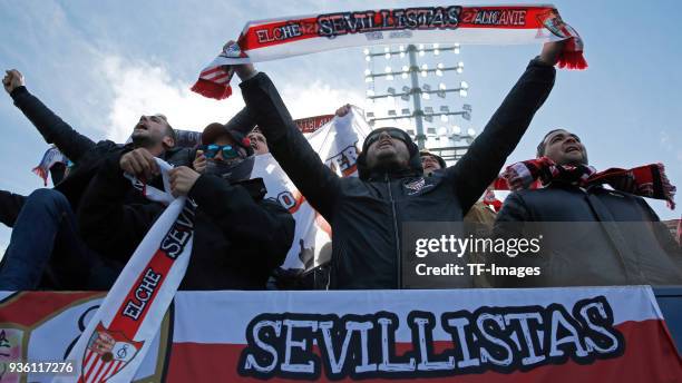 Supporters of Sevilla cheer for their team during the La Liga match between Leganes and Sevilla at Estadio Municipal de Butarque on March 18, 2018 in...