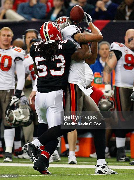 Jerramy Stevens of the Tampa Bay Buccaneers pulls in this reception against Mike Peterson of the Atlanta Falcons at Georgia Dome on November 29, 2009...