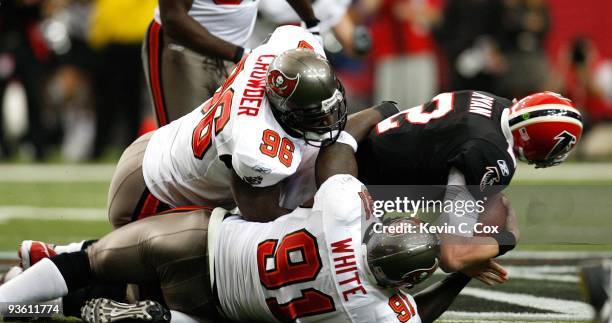 Matt Ryan of the Atlanta Falcons is injured on this sack by Tim Crowder and Stylez White of the Tampa Bay Buccaneers at Georgia Dome on November 29,...