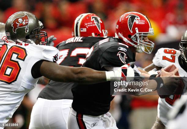 Matt Ryan of the Atlanta Falcons is sacked by Tim Crowder of the Tampa Bay Buccaneers at Georgia Dome on November 29, 2009 in Atlanta, Georgia.