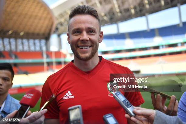 Chris Gunter of Wales national football team is interviewed in a training session before the semi-final match against China during the 2018 Gree...