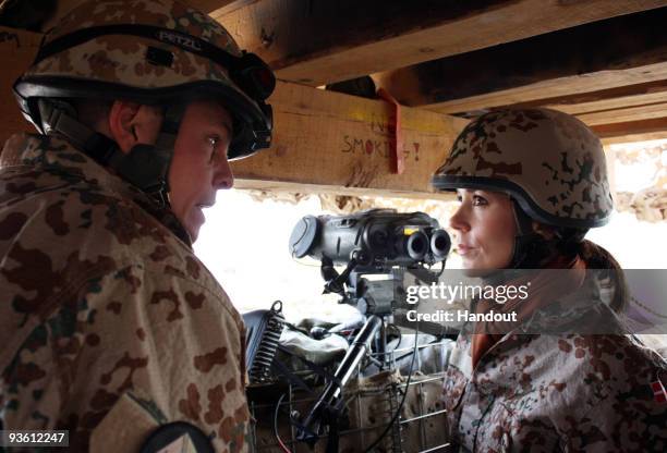 In this handout photo provided by The Danish Ministry of Defence, HRH Crown Princess Mary of Denmark visits Danish troops on November 30, 2009 in...