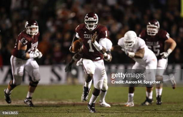 Quarterback Jerrod Johnson of the Texas A&M Aggies scrambles for a gain against the Texas Longhorns in the second half at Kyle Field on November 26,...