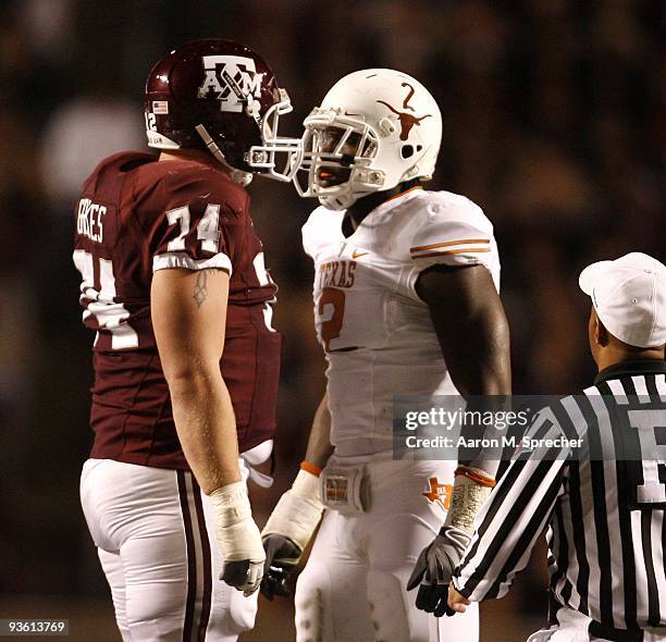 Right tackle Lee Grimes of the Texas A&M Aggies confronts defensive end Sergio Kindle of the Texas Longhorns in the first half at Kyle Field on...