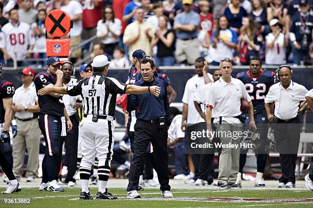 Head Coach Gary Kubiak of the Houston Texans talks with a referee during a game against the Indianapolis Colts at Reliant Stadium on November 29,...