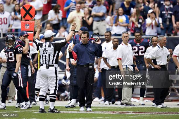 Head Coach Gary Kubiak of the Houston Texans talks with a referee during a game against the Indianapolis Colts at Reliant Stadium on November 29,...