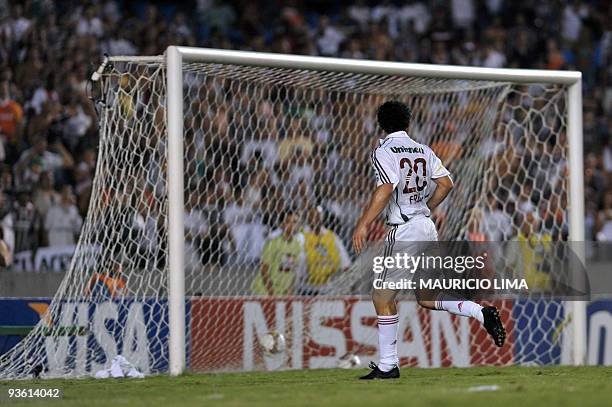 Fred, of Brazil's Fluminense, scores the second goal of the team against Ecuador's Liga Deportiva de Quito, during their Copa Sudamericana final...