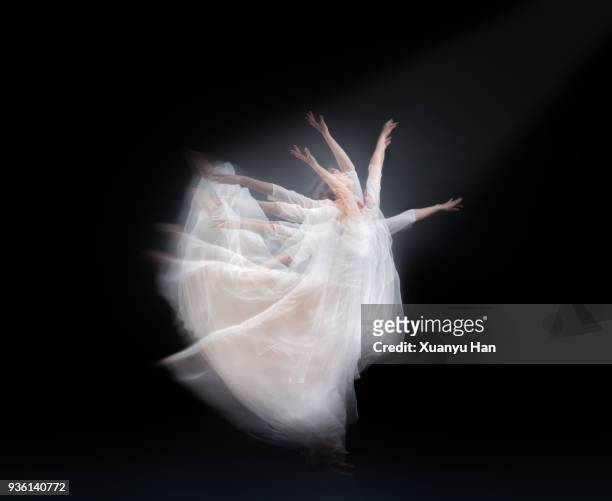 the dancer on black background - long exposure dancer stock-fotos und bilder