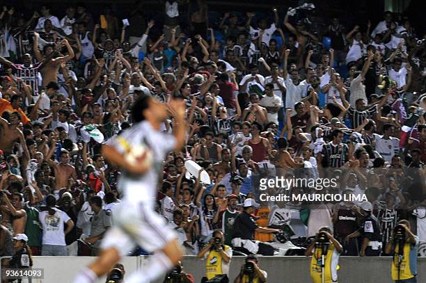 Supporters of Brazil's Fluminense celebrate the second goal of the team scored by Fred against Ecuador's Liga Deportiva de Quito, during their Copa...