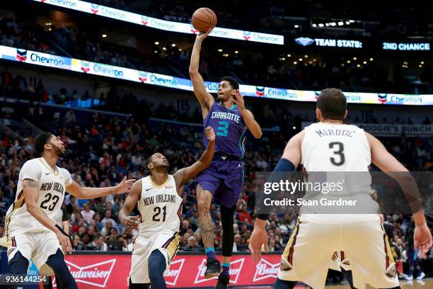 Mangok Mathiang of the Charlotte Hornets takes a shot over Darius Miller of the New Orleans Pelicans during the second half of a NBA game at the...