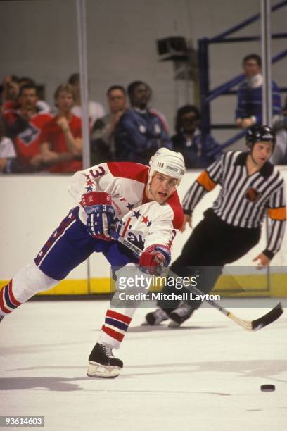 Scott Stevens of the Washington Capitals passes off the puck during a NHL hockey game against the Philadelphia Flyers on March 25, 1988 at Capitol...