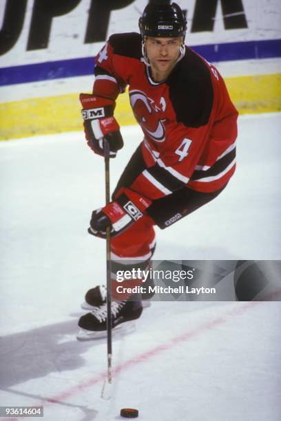 Scott Stevens of the New Jersey Devils skates with the puck during a NHL hockey game against the Washington Capitals on Janaury 14, 1994 at USAir...