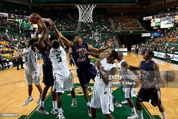 Justin Davis of the Florida Atlantic Owls battles for a rebound against the South Florida Bulls during the game at the SunDome on November 27, 2009...