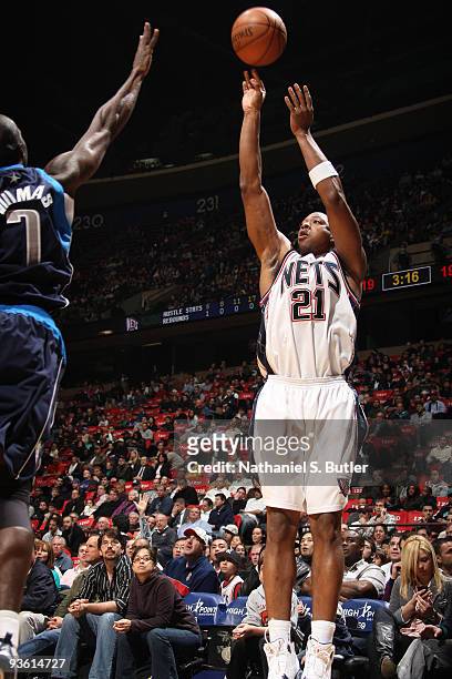 Bobby Simmons of the New Jersey Nets shoots against Tim Thomas of the Dallas Mavericks on December 2, 2009 at the IZOD Center in East Rutherford, New...