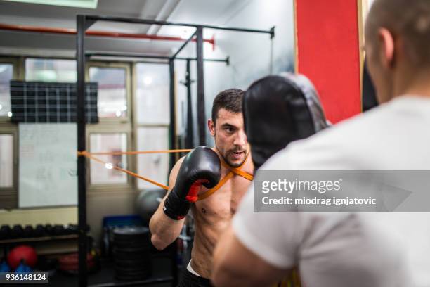 two men training kickbox - kickboxing stock pictures, royalty-free photos & images