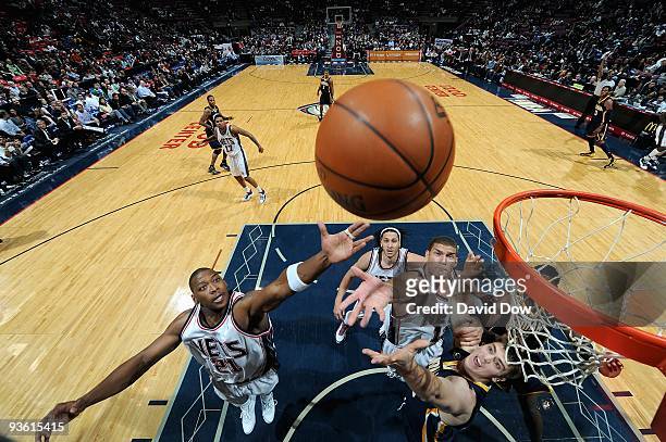 Bobby Simmons of the New Jersey Nets goes to the basekt over Tyler Hansbrough of the Indiana Pacers during the game on November 17, 2009 at the Izod...