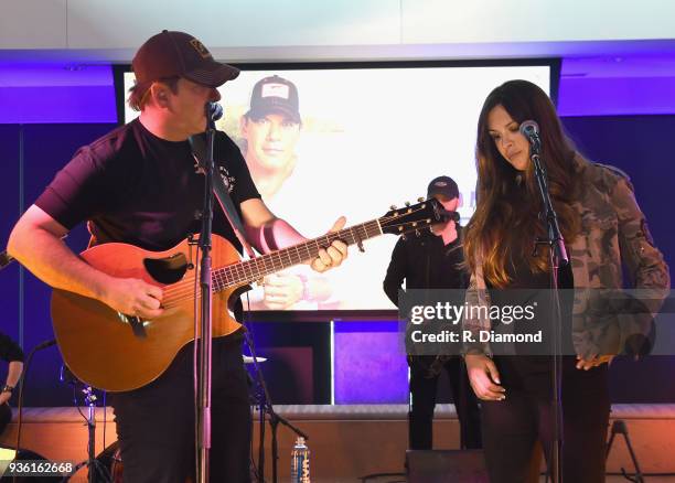 Rodney Atkins and Rose Falcon-Atkins perform during Rodney's Listening Event on The Steps at WME on March 21, 2018 in Nashville, Tennessee.