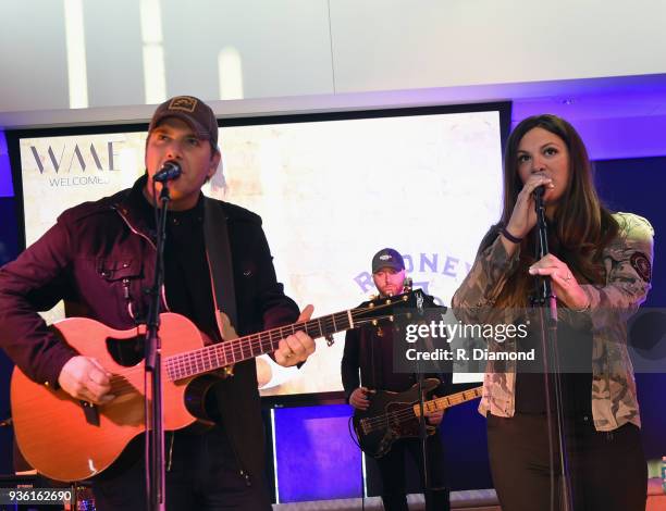 Rodney Atkins and Rose Falcon-Atkins perform during Rodney's Listening Event on The Steps at WME on March 21, 2018 in Nashville, Tennessee.