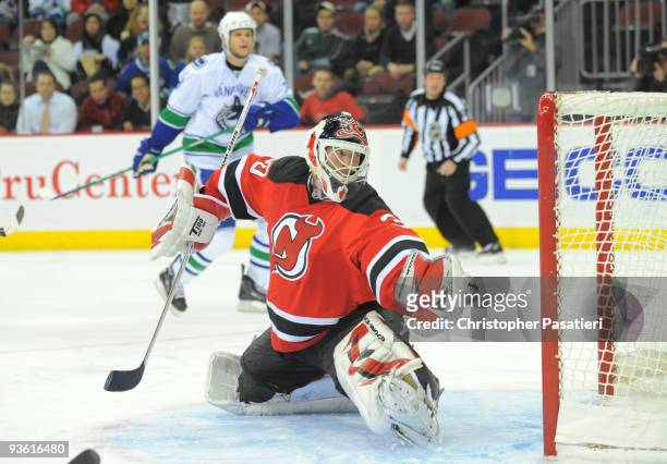 Martin Brodeur of the New Jersey Devils looks back after allowing a third period goal to Jannik Hansen of the Vancouver Canucks on December 2, 2009...