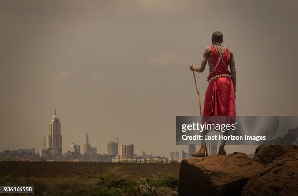 masai man with traditional dress watching nairobis skyline, nairobi, nairobi area, kenya - kenyan culture stock pictures, royalty-free photos & images