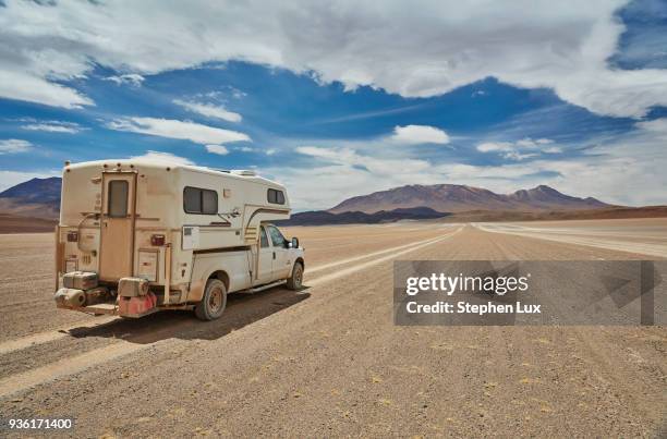 recreational vehicle, travelling across landscape, rear view, villa alota, potosi, bolivia, south america - alota stock pictures, royalty-free photos & images