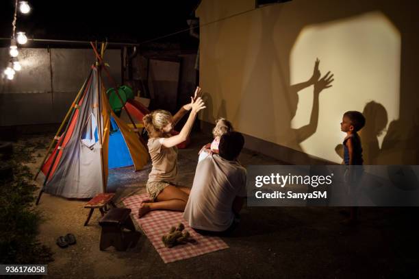 storytelling in our backyard - shadow puppets stock pictures, royalty-free photos & images