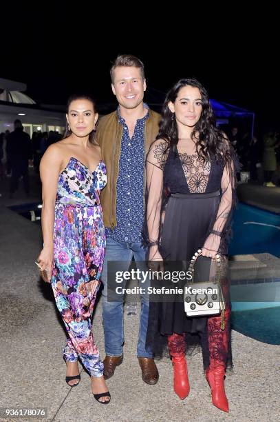 Toni Trucks, Glen Powell and Natalie Martinez attend FENDI x Flaunt Celebrate The New Fantasy Issue at Casa Perfect on March 21, 2018 in Beverly...