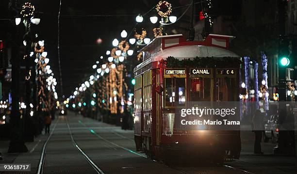 Streetcar passes along Canal Street decorated with Christmas lights December 2, 2009 in New Orleans, Louisiana. People across the country are getting...