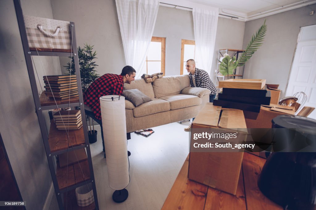 Cute couple moving furniture