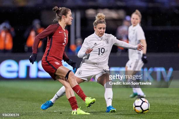 Germany forward Svenja Huth battles with United States defender Kelley O'Hara during the game between the United States and Germany on March 01, 2018...