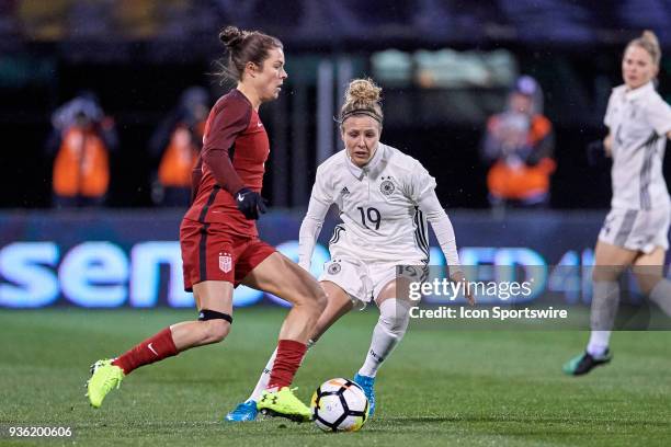 Germany forward Svenja Huth battles with United States defender Kelley O'Hara during the game between the United States and Germany on March 01, 2018...