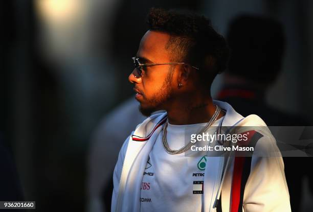 Lewis Hamilton of Great Britain and Mercedes GP walks in the Paddock during previews ahead of the Australian Formula One Grand Prix at Albert Park on...