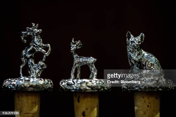 Animal figurines crafted out of silver stand on display inside the Joh. Springer's Erben Handels rifle and hunting supplies store in Vienna, Austria,...