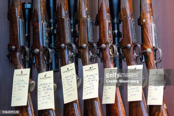 Artisanal Mauser M 98 repeating rifles stand on display inside the Joh. Springer's Erben Handels rifle and hunting supplies store in Vienna, Austria,...