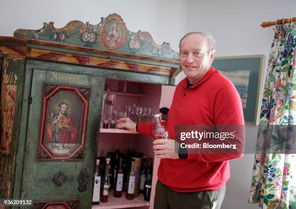 Heinrich Bubna-Litic, forest owner and hunter, poses for a photograph by his schnapps cabinet inside his hunting lodge near the village of Stanz im...