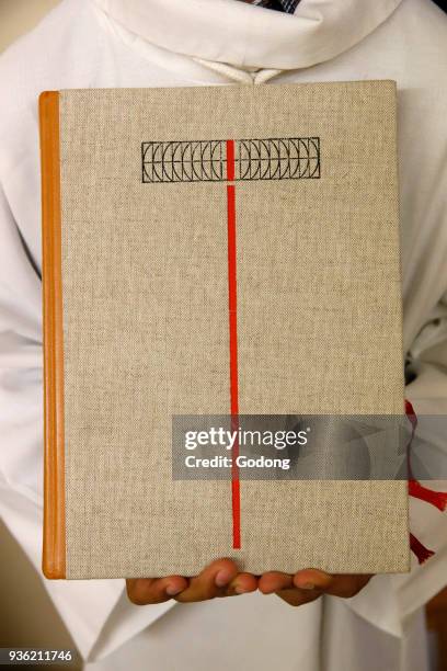 Deacon ordinations in Notre Dame du Travail church, Paris. Gospel. France.