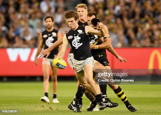 Paddy Dow of the Blues kicks during the round one AFL match between the Richmond Tigers and the Carlton Blues at Melbourne Cricket Ground on March...