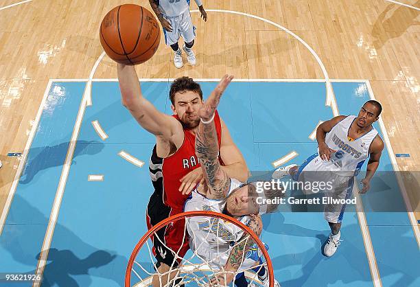 Andrea Bargnani of the Toronto Raptors goes for the dunk against Chris Andersen of the Denver Nuggets during the game on November 17, 2009 at the...