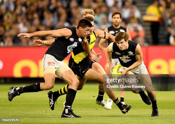 Paddy Dow of the Blues gathers the ball during the round one AFL match between the Richmond Tigers and the Carlton Blues at Melbourne Cricket Ground...