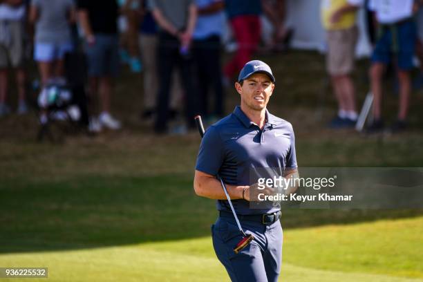 Rory McIlroy of Northern Ireland looks on after his second shot to the 15th hole green during round one of the World Golf Championships-Dell...