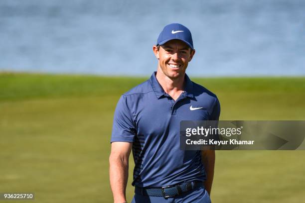 Rory McIlroy of Northern Ireland smiles after making a long birdie putt on the 14th hole green during round one of the World Golf Championships-Dell...